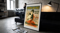 Woman brushing teeth with toothpaste print in a slim black frame leaning on a dark sofa in a concrete print studio