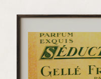 Close-up of the Vintage French perfume label print's dark wood frame corner and archival matte paper