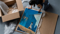 Girl Hanging Laundry in the Sun framed print being unpacked from protective bubble wrap and a box