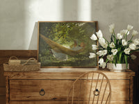 Girl reading in a hammock print in an oak frame on a farmhouse dresser beside white tulips