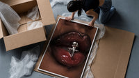 Glossy Lips with a Silver Charm framed print being unpacked from protective bubble wrap and a box