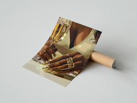 Gently curled Gold Nails and a Stemmed Glass print beside its protective shipping tube