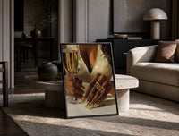 Gold Nails and a Stemmed Glass print on the floor, leaning against a travertine table