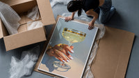 Champagne Coupe framed print being unpacked from protective bubble wrap and a box