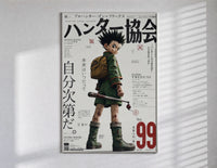 Anime boy with backpack and fishing rod poster in a slim frame on a bright wall with soft window light