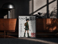 Black-framed Anime boy with backpack and fishing rod print on a moody console with designer coffee-table books