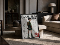 Anime boy with backpack and fishing rod print in a black frame leaning on a travertine table in a sunlit lounge