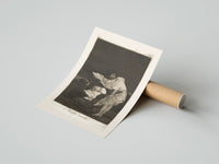 Rolled Woman battling wind in cloak poster beside its crush-resistant kraft shipping tube