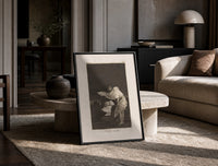 Woman battling wind in cloak print in a black frame leaning on a travertine table in a sunlit lounge