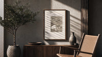 Winged figures and bird-people above sleeping women poster framed above a fluted sideboard beside an olive tree