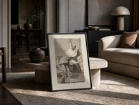 Grotesque figures screaming with raised arms print in a black frame leaning on a travertine table in a sunlit lounge