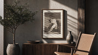 man embracing dying woman poster framed above a fluted sideboard beside an olive tree