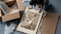 Owl above bound couple framed print being unpacked from protective bubble wrap and a box