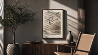 Two witches flying on a broom poster framed above a fluted sideboard beside an olive tree
