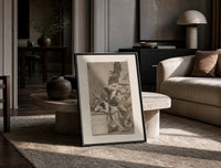 Sleeping man surrounded by owls and bats print in a black frame leaning on a travertine table in a sunlit lounge