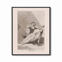 Framed Man grieving over collapsed woman print shown as a bold statement piece on a clean gallery wall