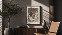 Two figures with locked faces attacked poster framed above a fluted sideboard beside an olive tree