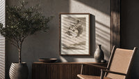 Witches flying with monkey demon poster framed above a fluted sideboard beside an olive tree