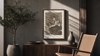 Grotesque figures spinning thread poster framed above a fluted sideboard beside an olive tree