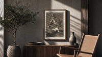 Grotesque figures climbing atop one another poster framed above a fluted sideboard beside an olive tree