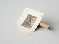 Rolled witch scene with goat demon poster beside its crush-resistant kraft shipping tube