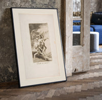 Grotesque figures carrying woman aloft print in a black frame leaning beside a vintage door on parquet