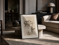 Woman fleeing winged demons print in a black frame leaning on a travertine table in a sunlit lounge