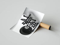 Graffiti handstyle tag with glossy black 8 ball on clean white in a rolled poster mockup