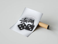 Rolled poster showing dripping graffiti handstyle tag beside a glossy black dice on white
