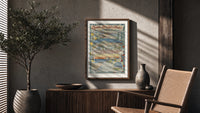 French Riviera coastal town views poster framed above a fluted sideboard beside an olive tree