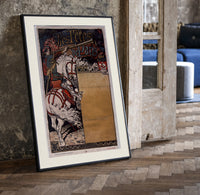 Medieval herald on white horse with trumpet print in a black frame leaning beside a vintage door on parquet