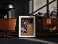 Black-framed Medieval herald on white horse with trumpet print on a moody console with designer coffee-table books