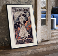 Joan of Arc in armor print in a black frame leaning beside a vintage door on parquet