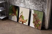 Green Blouse, Heels and Rings Set of 3 as black-framed prints leaning against a raw-plaster wall
