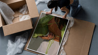 Green Tie-Back Blouse and White Trousers framed print being unpacked from protective bubble wrap and a box