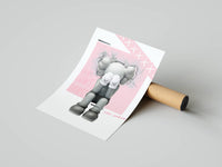 Standing grey KAWS Companion in see-no-evil pose on a pink X-pattern background, shown with a shipping tube