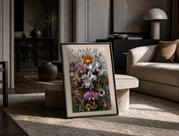 Botanical illustration of various orchids print in a black frame leaning on a travertine table in a sunlit lounge