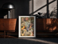 Black-framed Sea anemones illustration print on a moody console with designer coffee-table books