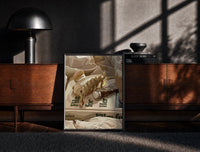 Black-framed Hair Claw and Cosmetic Tube print on the floor in front of a dark wooden console