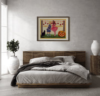 Two children bobbing for apples print in a dark wood frame above a rattan bed on a plaster wall
