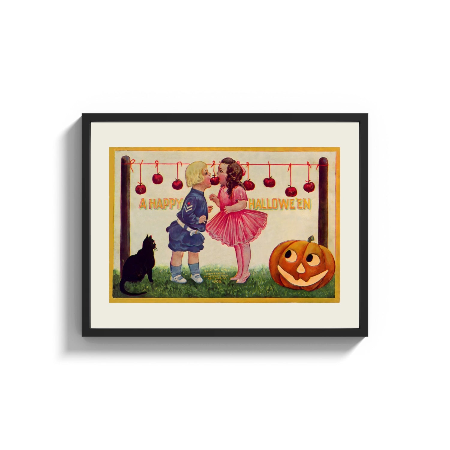 Framed Two children bobbing for apples print shown as a wide statement piece on a clean white wall