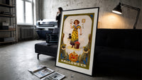 Girl holding snake with black cat print in a slim black frame leaning on a dark sofa in a concrete print studio