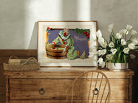 Clown bobbing for apples print in an oak frame on a farmhouse dresser beside white tulips