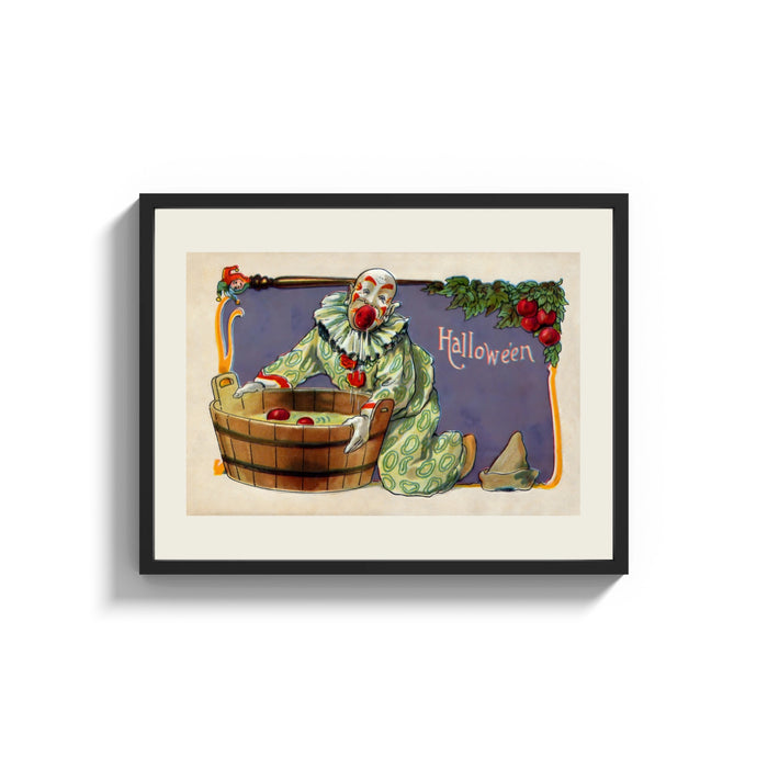 Framed Clown bobbing for apples print shown as a wide statement piece on a clean white wall