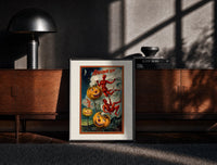 Black-framed Grinning jack-o-lantern pumpkins with red devils print on a moody console with designer coffee-table books