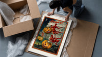 Grinning jack-o-lantern pumpkins with red devils framed print being unpacked from protective bubble wrap and a box