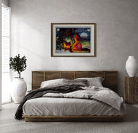 Witch girl sitting by cauldron fire print in a dark wood frame above a rattan bed on a plaster wall