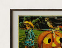 Close-up of the Two children carrying jack-o-lantern pumpkin print's dark wood frame corner and archival matte paper