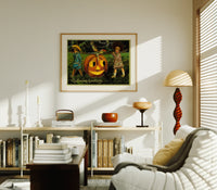 Two children carrying jack-o-lantern pumpkin print in an oak frame above a mid-century book console with a vintage radio