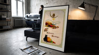 Vintage Halloween owl cat pumpkin print in a slim black frame leaning on a dark sofa in a concrete print studio